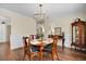 Charming dining room with hardwood floors, a classic hutch, and natural light at 3545 Rookwood Pl, Johns Island, SC 29455