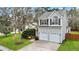 Beautiful two-story home with gray siding, a two-car garage, and lush green lawn at 3545 Rookwood Pl, Johns Island, SC 29455