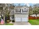 Charming home with gray siding, two-car garage, and a well-maintained front lawn at 3545 Rookwood Pl, Johns Island, SC 29455