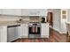 Well-equipped kitchen showcasing stainless steel appliances and beautiful wood flooring at 3545 Rookwood Pl, Johns Island, SC 29455