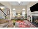 Spacious living room with a fireplace, tall ceilings, and a view of the staircase at 3545 Rookwood Pl, Johns Island, SC 29455