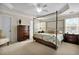 Serene main bedroom with a four-poster bed, soft lighting, and neutral decor at 3545 Rookwood Pl, Johns Island, SC 29455