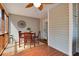Screened patio with wooden table and chairs, a ceiling fan, and views of the backyard at 3545 Rookwood Pl, Johns Island, SC 29455