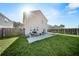 Spacious backyard with lush green lawn, fenced perimeter, patio, and outdoor seating area at 362 Sanctuary Park Dr, Summerville, SC 29486