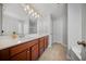 Bathroom features a double sink vanity with granite countertops and ample lighting at 362 Sanctuary Park Dr, Summerville, SC 29486