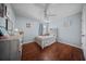Bright bedroom featuring hardwood floors, ceiling fan and a large window letting in natural light at 362 Sanctuary Park Dr, Summerville, SC 29486