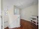 Hallway with hardwood floors, white wainscoting, and a small book shelf at 362 Sanctuary Park Dr, Summerville, SC 29486