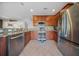 Well-lit kitchen featuring stainless steel appliances, granite countertops, and ample wood cabinetry at 362 Sanctuary Park Dr, Summerville, SC 29486