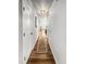 Inviting hallway featuring hardwood floors, a decorative runner, and ample natural light at 404 Black Oak Blvd, Summerville, SC 29485