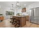 Kitchen with a center island, wood cabinets, and stainless steel refrigerator and range hood at 404 Black Oak Blvd, Summerville, SC 29485