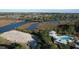 Stunning aerial view of a waterway community with a resort-style pool, pavilion, and lush landscape at 4070 Egret Perch Ct, Ravenel, SC 29470
