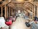 Unfinished attic space with exposed beams showing potential for storage or customization at 4070 Egret Perch Ct, Ravenel, SC 29470