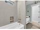 Modern bathroom with soaking tub, tiled walls, and a stylish vanity at 4070 Egret Perch Ct, Ravenel, SC 29470