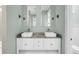 Elegant bathroom vanity with double sinks, stylish fixtures, and modern lighting at 4070 Egret Perch Ct, Ravenel, SC 29470