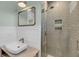 Bathroom featuring a modern floating vanity, square mirror, and large glass shower with gray tiling at 4070 Egret Perch Ct, Ravenel, SC 29470
