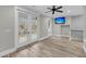 Bedroom with French doors to balcony, ceiling fan, and a mounted television at 4070 Egret Perch Ct, Ravenel, SC 29470