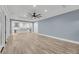 Open-concept living area flows into a modern kitchen with white cabinets and an island at 4070 Egret Perch Ct, Ravenel, SC 29470
