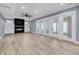 Living room featuring a black fireplace and wall of glass doors at 4070 Egret Perch Ct, Ravenel, SC 29470