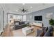 Cozy living room with comfortable seating, a ceiling fan, and a view into the kitchen at 4070 Egret Perch Ct, Ravenel, SC 29470