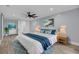 Stylish main bedroom with shiplap wall, decorative rug, and beach-themed artwork at 4070 Egret Perch Ct, Ravenel, SC 29470