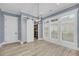 Sitting room featuring custom shelving, sliding closet doors, and natural light at 4070 Egret Perch Ct, Ravenel, SC 29470