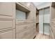 Spacious walk-in closet with custom shelving, drawers, and ample storage space at 4070 Egret Perch Ct, Ravenel, SC 29470