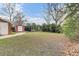 Large grassy backyard with a shed, deck and pergola sitting area at 4203 Marilyn Dr, North Charleston, SC 29418
