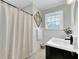Charming bathroom featuring classic tilework, stylish fixtures, and natural light at 4203 Marilyn Dr, North Charleston, SC 29418