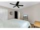 Neutral bedroom with a television sitting on a table, ceiling fan, closet and ensuite access at 4203 Marilyn Dr, North Charleston, SC 29418