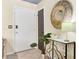 The entryway features a mirror with a console table and tile floors, creating a welcoming ambiance at 4203 Marilyn Dr, North Charleston, SC 29418