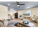 Spacious living room featuring stylish decor, hardwood floors, and an open layout leading to the kitchen at 4203 Marilyn Dr, North Charleston, SC 29418