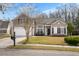 Charming home with a two-car garage, welcoming front porch, and a neatly landscaped yard at 459 Blue Dragonfly Dr, Charleston, SC 29414