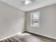 Bedroom features neutral paint, wood-style floors, overhead ceiling fan and natural light from window at 4604 Garwood Dr, Ladson, SC 29456