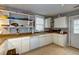 Kitchen featuring white cabinets, tile flooring, and modern appliances at 4758 Aster Dr, North Charleston, SC 29405