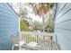 Picturesque balcony with seating and a view of a tranquil waterway surrounded by lush trees at 482 Sea Cloud Cir, Edisto Island, SC 29438