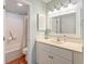 This bathroom features a vanity, framed mirror, and shower-tub combo at 482 Sea Cloud Cir, Edisto Island, SC 29438