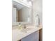 Bathroom features a well-lit vanity with a white countertop, modern faucet, and a large mirror at 482 Sea Cloud Cir, Edisto Island, SC 29438