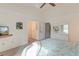 Comfortable bedroom with a ceiling fan, soft carpet, and stylish white furniture creating a bright and airy space at 482 Sea Cloud Cir, Edisto Island, SC 29438