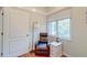 Small bedroom showcasing a recliner, side table, and window providing natural light at 482 Sea Cloud Cir, Edisto Island, SC 29438