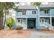 Charming blue condo with covered parking, a well-kept lawn, and a welcoming entrance at 482 Sea Cloud Cir, Edisto Island, SC 29438