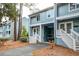 Exterior of blue two-story condos with private covered parking and white stairs at 482 Sea Cloud Cir, Edisto Island, SC 29438