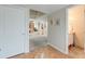 Hallway view looking to the living room, kitchen, and a powder room at 482 Sea Cloud Cir, Edisto Island, SC 29438
