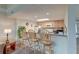 Kitchen bar with seating for three, overhead lighting, light-colored cabinets and granite countertops at 482 Sea Cloud Cir, Edisto Island, SC 29438