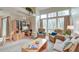 Cozy living room featuring a high ceiling, large windows, and comfortable furniture at 482 Sea Cloud Cir, Edisto Island, SC 29438