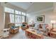 Spacious living room with ample seating, vaulted ceilings, large windows, and stylish furnishings at 482 Sea Cloud Cir, Edisto Island, SC 29438