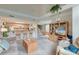 Open-concept living room flowing into the kitchen and dining area with a high ceiling at 482 Sea Cloud Cir, Edisto Island, SC 29438