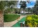 A miniature golf course surrounded by lush landscaping, offering a recreational amenity for residents at 482 Sea Cloud Cir, Edisto Island, SC 29438