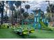 Community playground featuring modern play structures and green turf, perfect for Gathering fun at 482 Sea Cloud Cir, Edisto Island, SC 29438