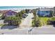 Aerial view of property with beach access, showcasing proximity to the ocean and surrounding homes at 502 W Ashley Ave, Folly Beach, SC 29439