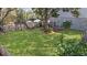 View of a lush, green backyard with a partial fence and mature trees offering shade and privacy at 502 W Ashley Ave, Folly Beach, SC 29439